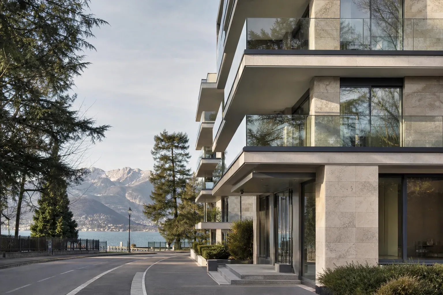 Photo réaliste d’un immeuble contemporain haut de gamme dans le Triangle d’Or d’Annecy, avec façade vitrée, balcons et ambiance lacustre.